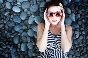 A rested young woman wearing sunglasses after sleep apnea treatment in Friendswood.